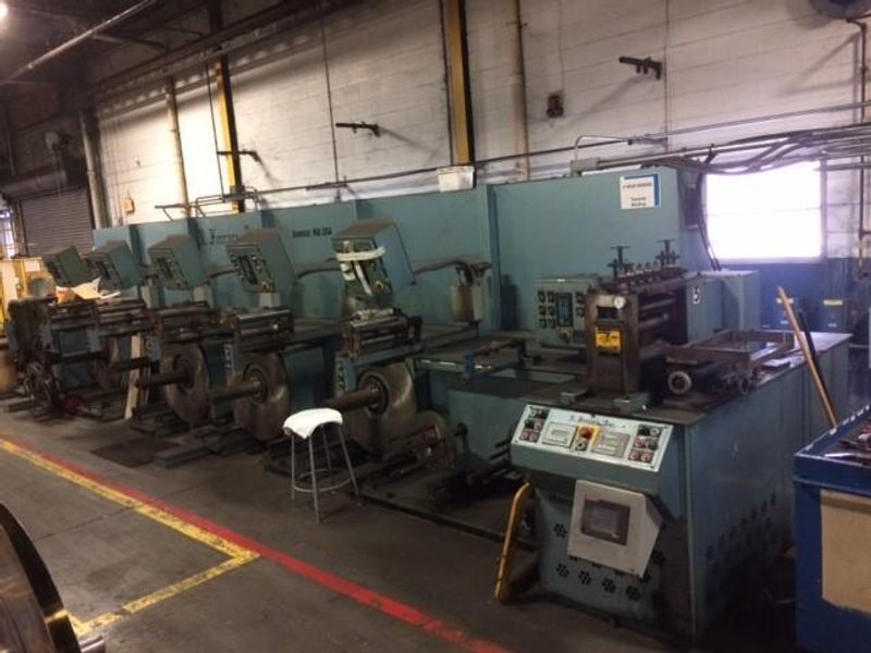 12"  FERRARA SLITTING LINE WITH 5 HEAD TRAVERSE WINDER