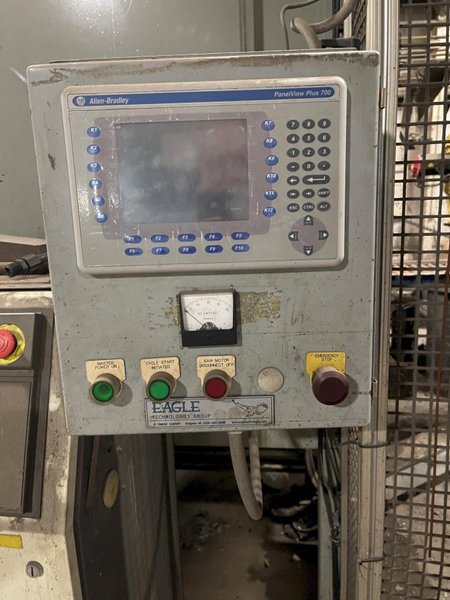 2005 Eagle automated saw and knockout system s/n 05027 with enclosure with light curtain, 2005 Fanuc robot model M-900iA 350 s/n r05743652 with Fanuc system R-J3iB controls s/n e05608535, with saw grips, Eagle enclosure with core knockout system, Allen Bradley plc with panelview 700, core butt discharge conveyor with drive, gate and riser dropoff, related conveyors
