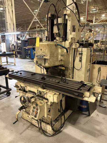 65" X 15" OKK MH-3VII 10HP VERTICAL MILLING MACHINE. STOCK # 1085526