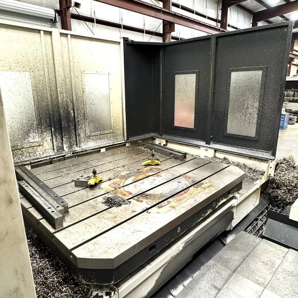 Kuraki AKB-13 5″ Spindle Horizontal Boring Mill, 2015 – Fanuc 0iMB Control 5 Axis Control, 60 ATC, 1000 psi TSC, Rigid Tap, Full B Axis 360 Degree Rotary Table, Barnes Chip/Coolant Separator w/ Lift Up Conveyor
