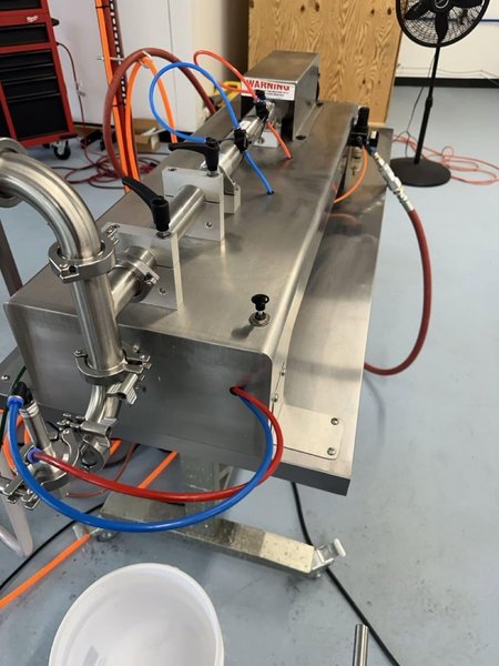 Accutek SVF 02-002-000 Single Piston Filler with Conveyor, Heated and Agitated Hopper, and E-Pak Accumulation Table, 2014