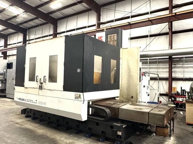 Kuraki AKB-13 5″ Spindle Horizontal Boring Mill, 2015 – Fanuc 0iMB Control 5 Axis Control, 60 ATC, 1000 psi TSC, Rigid Tap, Full B Axis 360 Degree Rotary Table, Barnes Chip/Coolant Separator w/ Lift Up Conveyor