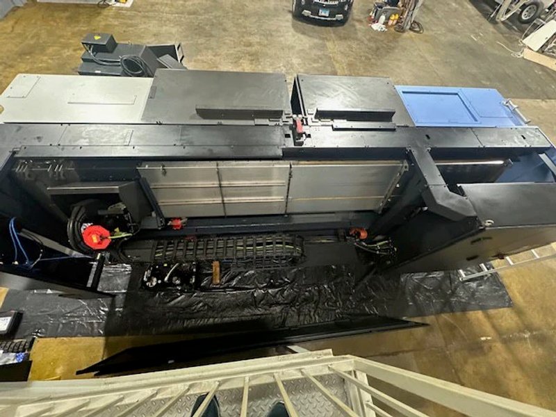 2023 DN SOLUTIONS PUMA 4100LMB CNC Universal Turning Center. Equipped for versatile 2-axis and 3-axis lathing, it features a 15" chuck, 50 HP spindle, and a machining length of 79.8" and with hydraulic open / close steady rest. Perfect for heavy-duty tasks. Fanuc Control, 50HP