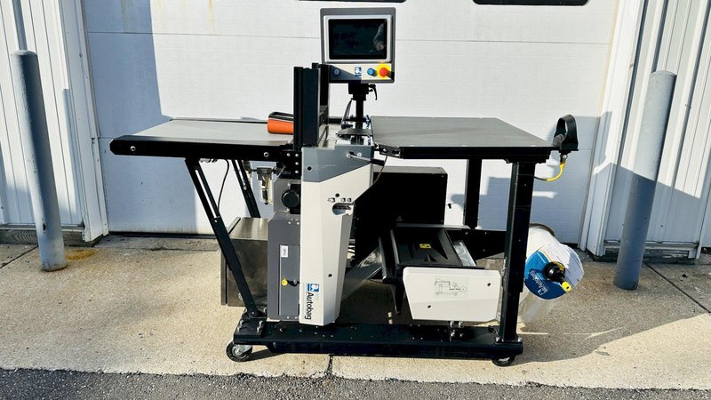 Automated Packaging Systems | Autobag 600 Bagger System  |  Vertical Orientation for Package Fulfilment with Powered Outfeed Conveyor