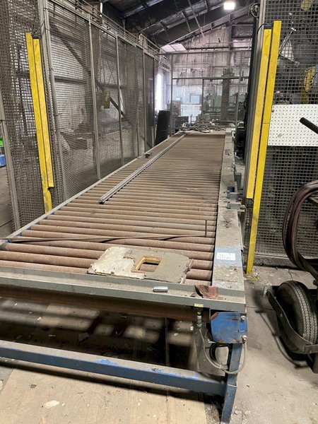 2005 Eagle automated saw and knockout system s/n 05027 with enclosure with light curtain, 2005 Fanuc robot model M-900iA 350 s/n r05743652 with Fanuc system R-J3iB controls s/n e05608535, with saw grips, Eagle enclosure with core knockout system, Allen Bradley plc with panelview 700, core butt discharge conveyor with drive, gate and riser dropoff, related conveyors