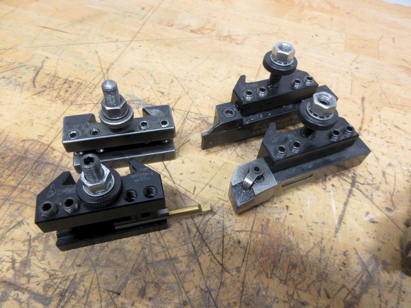 Manual Lathe Tooling, (3) Dorian QITP25-N and (1) Aloris AXA 1 Tool Post Holders, Jacobs Keyed Chuck &amp; Live Center with #2 MT, Royal Live Center 1" Straight Shank- Auction Item