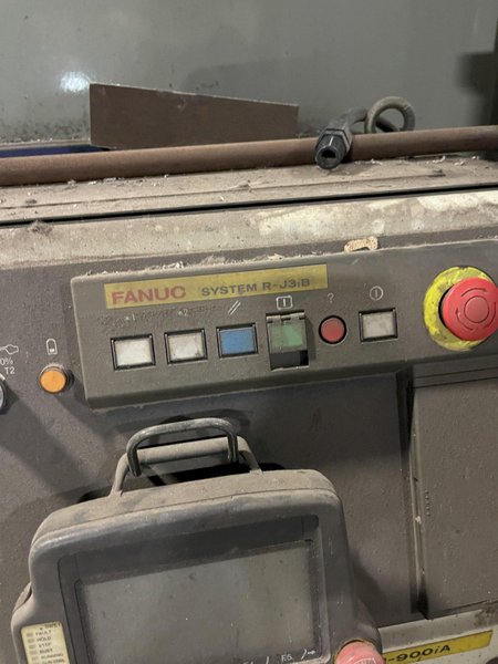 2005 Eagle automated saw and knockout system s/n 05027 with enclosure with light curtain, 2005 Fanuc robot model M-900iA 350 s/n r05743652 with Fanuc system R-J3iB controls s/n e05608535, with saw grips, Eagle enclosure with core knockout system, Allen Bradley plc with panelview 700, core butt discharge conveyor with drive, gate and riser dropoff, related conveyors
