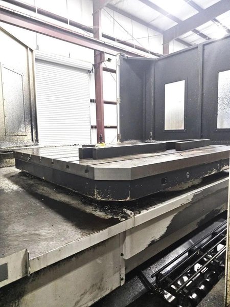 Kuraki AKB-13 5″ Spindle Horizontal Boring Mill, 2015 – Fanuc 0iMB Control 5 Axis Control, 60 ATC, 1000 psi TSC, Rigid Tap, Full B Axis 360 Degree Rotary Table, Barnes Chip/Coolant Separator w/ Lift Up Conveyor