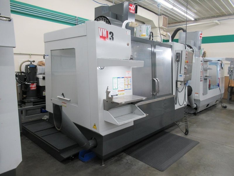 Haas VM-3 CNC Vertical Machining Center, Haas MainCon Ctrl, 4th &amp; 5th Axis Drive, 1000 PSI TSC, Probing, High Speed Machining, 24+1, RJH- Auction Item