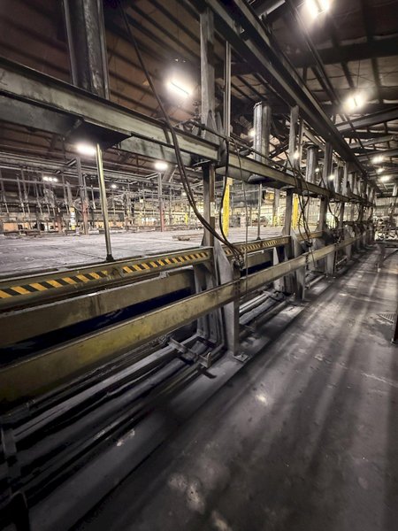 8- air operated pallet line approx. 80' long with air dump and air lifts, 20" x 60" trays, price is for all
