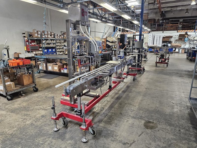 Accutek Bottling Line with Chadam Consultants 2 Head Gravity Filler, Accutek SA-1 Automatic Chuck Capper, Accutek APS106 Labelette Labeler, Everfilt Oil Filtration System, IBC Tanks