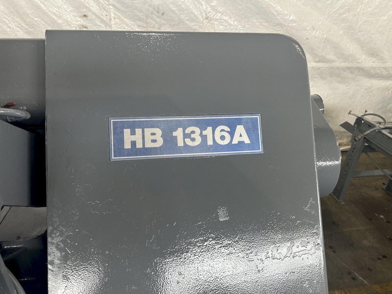 13" X 16" PEERLESS HB1316A HORIZONTAL BAND SAW W/ 10' INFEED AND 20' OUTFEED CONVEYOR. STOCK # 1164323.