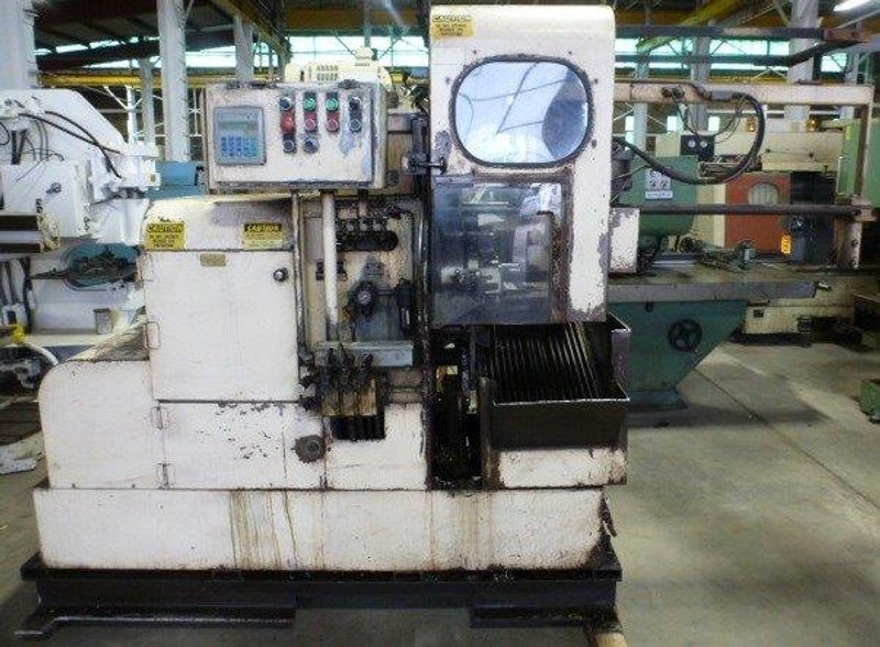 3-1/4" MODERN CUT-OFF MACHINE No. 3LD, 1/4" - 3-1/4", 20' Bar Feed, A-B PLC, Tooling, 10 HP, 1994