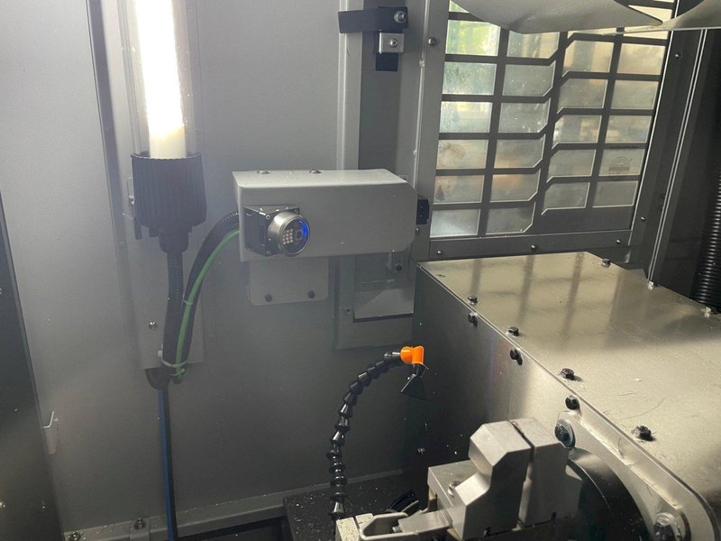 Tornos Almac CU 2007 7-Axis CNC Vertical Machining Center with Part Loading and Parts Catcher System, Probing, 20K Spindle, Lehman 2-Axis Rotary Table, Back Operation Tilting Rotary Vise