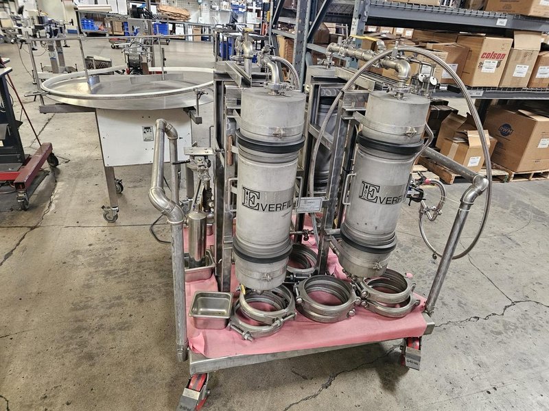 Accutek Bottling Line with Chadam Consultants 2 Head Gravity Filler, Accutek SA-1 Automatic Chuck Capper, Accutek APS106 Labelette Labeler, Everfilt Oil Filtration System, IBC Tanks