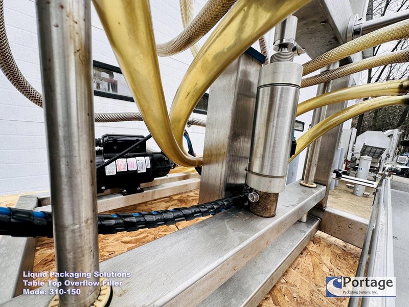 Liquid Packaging Solutions Model: 310-150  ||  Semi-Automatic Table Top Overflow Filler