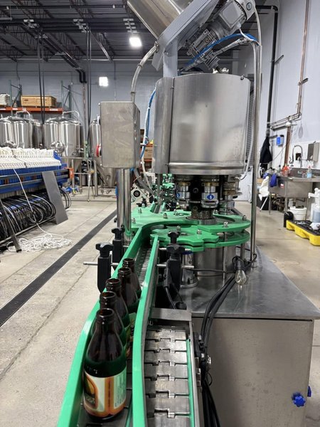 Zhangjiagang Bottling Line for Glass Bottles with Bottle Washer, Filler, Crowner, and Labeler