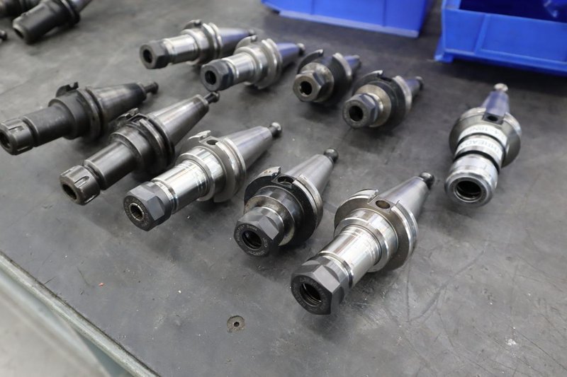 CT40 Taper Tool Holders: (9) Er20 Collet Holders, (1) Nikken SKN-16B Collet Holder- Auction Item