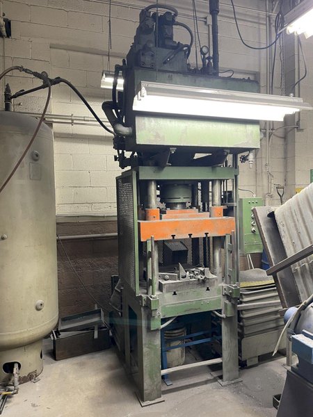 Hammond 50 ton 4 post hydraulic press with top mounted hydraulic system, 20" x 24" bolster, 7" ram, 20" l to r, 14 1/2" f to b, t slotted upper and lower, belt discharge