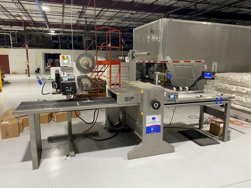 System Packaging 900-24 3B Labeler, 2020 – Weber Box Label Printer/Applicator Model: 5300 L.H. DOM, 1 Pallet of Cold Seal Material Included **Pre-Removal Pricing**