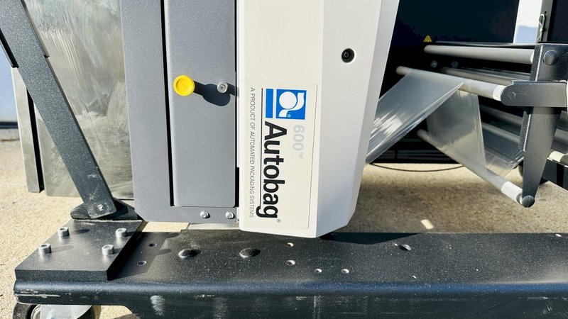 Automated Packaging Systems | Autobag 600 Bagger System  |  Vertical Orientation for Package Fulfilment with Powered Outfeed Conveyor