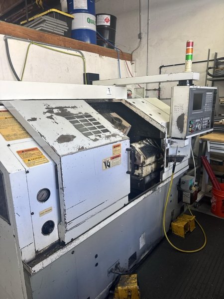 Okuma ES L8 CNC Lathe, 1999 – Tailstock, Chip Conveyor
