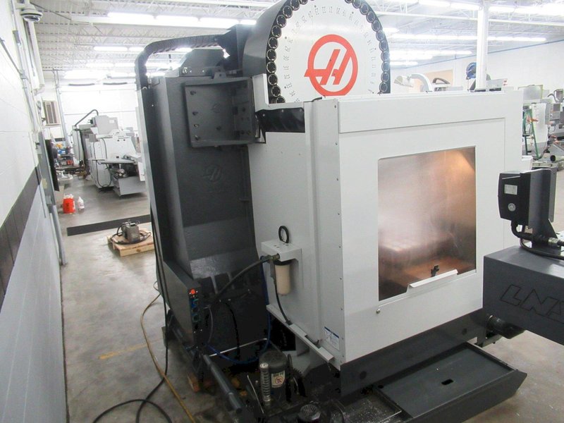 Haas VM-3 5-Axis CNC Vertical Machining Center, Haas TR-210 Trunnion, 40 Station Tool Changer, Probing, 300 PSI TSC, Chip Auger