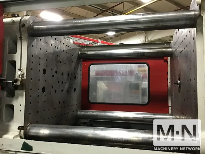 310 TON 36 OZ FERROMATIK MILACRON MODEL MT310-36 WIDE PLATEN INJECTION MOLDING MACHINE MFG 2001
