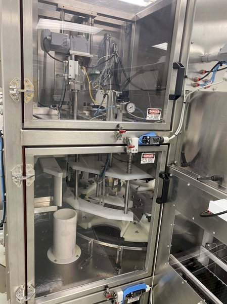 Inline Filling Systems Net-Weight Rotary Jar Filler with Integrated Capping for Clean Room Application in Semi-Conductor Industry, 2009