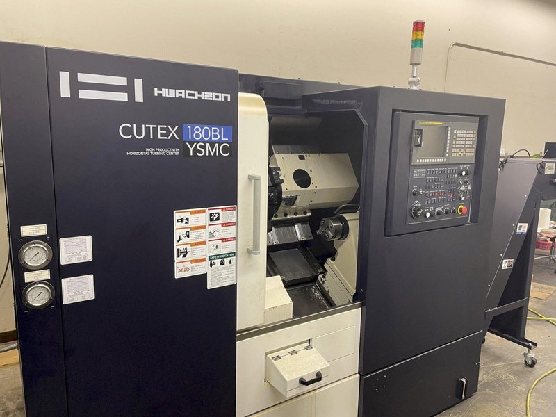 Hwacheon Cutex-180BL YSMC Multi-Axis CNC Lathe 2018 with: Fanuc OiTF CNC Control, Horizontal Linear Guide, Slant Longbed, 8" Chuck, Milling, Tool Presetter, High Pressure Pump, HTLD, Barfeed Interface, Rigid Tapping, Parts Catcher, and Chip Conveyor.