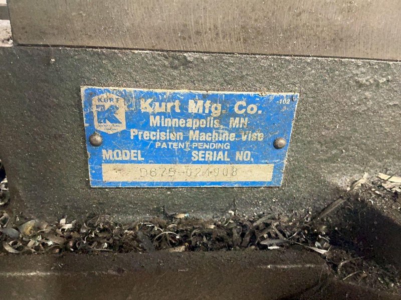 KURT MFG. CO. 6” PRECISION MACHINE VISE ON RISER BLOCK  -  D675