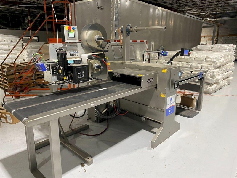 System Packaging 900-24 3B Labeler, 2020 – Weber Box Label Printer/Applicator Model: 5300 L.H. DOM, 1 Pallet of Cold Seal Material Included **Pre-Removal Pricing**