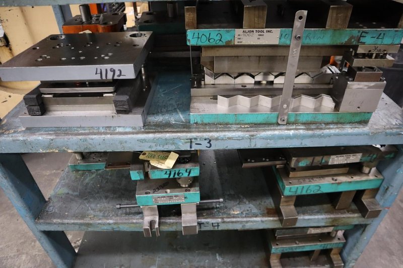 Press Dies on Steel Rack- Auction Item
