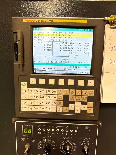 Bulova VMC-4220B Vertical Machining Center 2012 equipped with Fanuc OiMD Control, CT40 Spindle, 24 Station Automatic Tool Changer, Remote Jog Handle, Chip Conveyor, Chip Auger, Coolant Tank