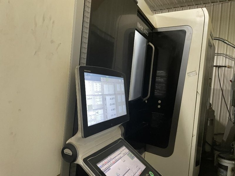 DMG Mori NHX5000 CNC Horizontal Machining Center with Pallet Changer, High Pressure Thru-Spindle Coolant, 60 Station Tool Changer, 50 HP High Torque 15,000 RPM Spindle