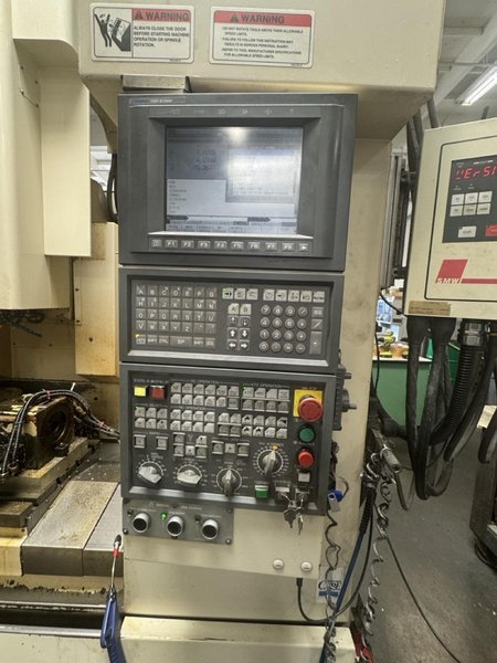 Okuma MC-V4020 VMC, 2005 – 4th Axis Rotary, Chip Conveyor