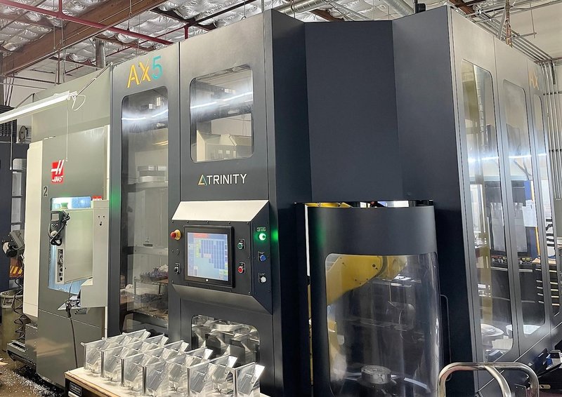 Haas UMC-750 5-Axis Trinity AX-55 Pallet APS 2019 with: Fanuc Robot, High Speed Machining, 40-ATC, 1000 PSI Through Spindle Coolant, Programmable Coolant, and Chip Conveyor.