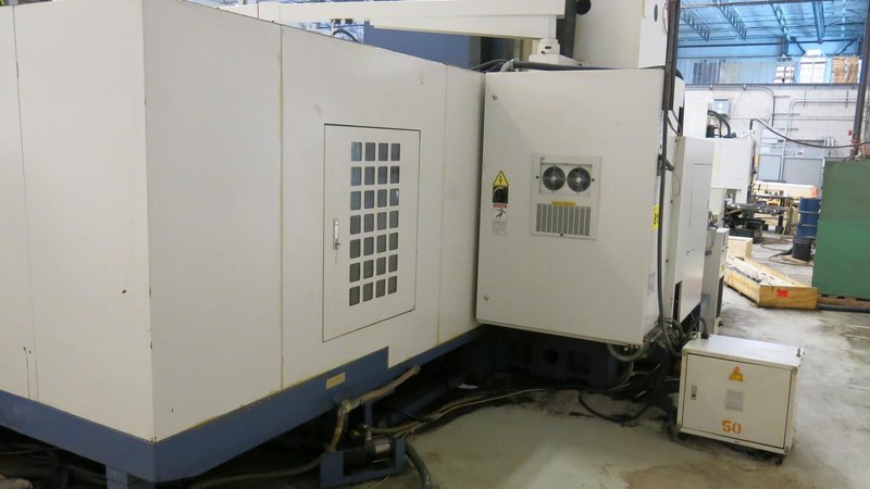 TAKUMI, V32, CNC VERTICAL MACHINING CENTRE, 10,000 RPM SPINDLE, TRAVELS (X,Y,Z): 3200 MM X 1066MM X 750 MM (126&quot; X 42&quot; X 30), DISTANCE FROM NOSE TO SPINDLE:  200MM TO 950MM, DISTANCE FROM SPINDLE NOSE TO THE Z-AXIS GUIDEWAY: 1120MM, T-SLOT TABLE SIZE: 3200MM X 1025MM (126&quot; X 40&quot;), MAX TABLE LOAD, 4500 KG (9,920 LBS), 32 TOOL ATC, TABLE SIZE: 42&quot; X 130&quot;, CAT 50, 30 KW, SPINDLE FLOOD AND THROUGH COOLANT, AIR BLAST, COOLANT FILTER SYSTEM, CHIP WASH DOWN SYSTEM, CHILLED BALL SCREW AND SPINDLE, 4-AXIS CAPABLE,  LEFT AND RIGHT CHIP CONVEYOR,  MITSUBISHI, MEDLAS 60S, CNC CONTROL, 2006, 220/3/60 50 AMP, MACHINE WEIGHT:  52.500 LBS. FLOOR SPACE (W, L, H) 295&quot; X 173&quot; X 139.7&quot; (APPROX.), S/N K0133
