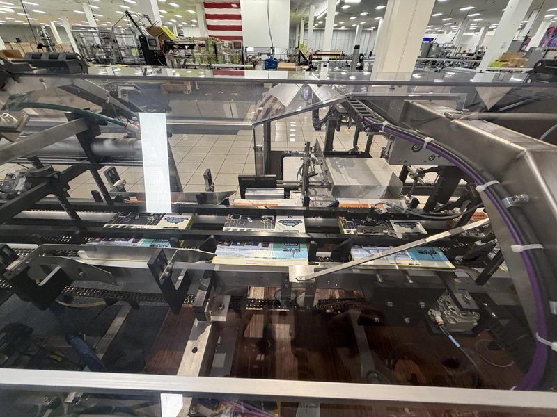 Complete Packaging Line for trays / flat Product including Custom Conveyor System, (2) Texwrap L-Bar Sealers and Heat Tunnels, Econocorp Automatic Cartoner and Case Packer and CTM Case labeler, 2023