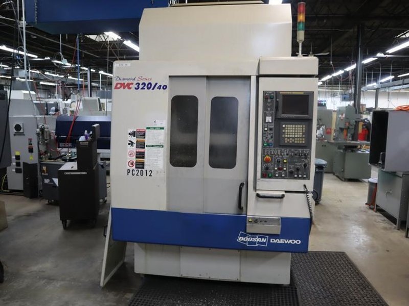 Daewoo Doosan 320/40 CNC Vertical Machining Center with 2 Station Pallet Changer, 12,000 RPM Spindle, 14 Station Rotary Turret, Chip Conveyor- Auction Item