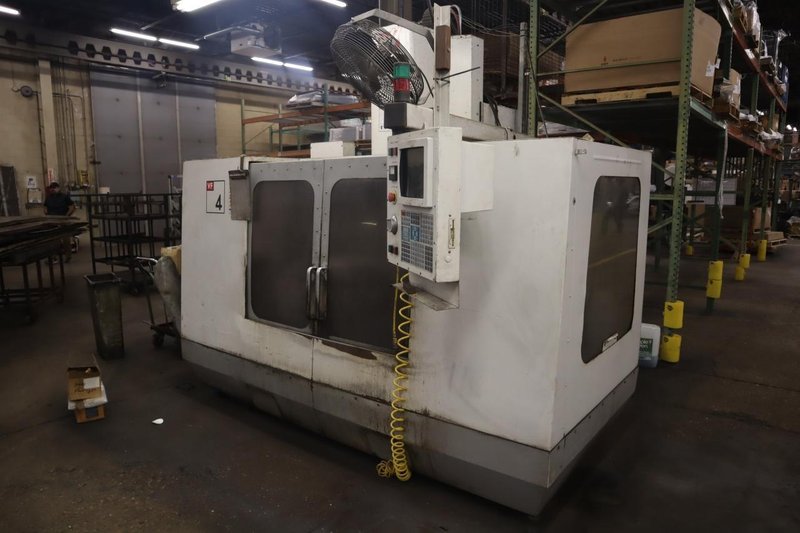 Haas VF-4 CNC Vertical Machining Center, 20 Station Carousel  Tool Changer, 7500 RPM Spindle, Chip Auger, Programmable Coolant- Auction Item