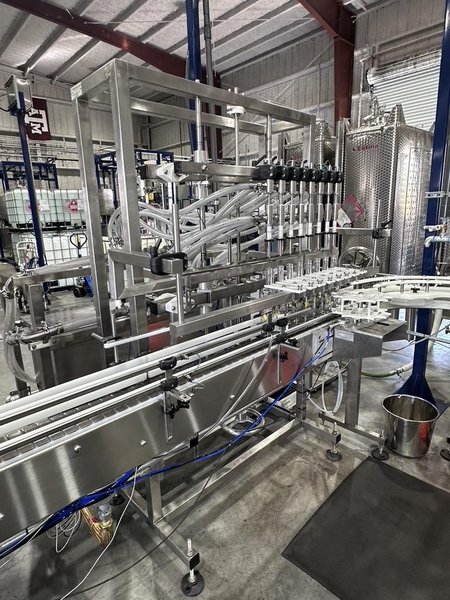 Inline Filling Systems Complete Used Bottling &amp; Labeling Line for Spirits (GNS 80 Proof Vodka) – Labeler, Filler, Capper, Conveyor, Heat Tunnel, Turntables &amp; More – C1D2 Hazardous Location Rated, 2024