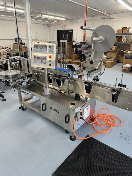 Tronics S30TP Wraparound and Top Labeler, 2018 – Includes Accumulation Table, Coder, Gap Transfer Conveyor