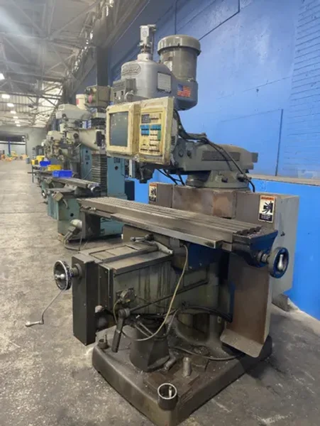 BRIDGEPORT 58” X 11” CNC VERTICAL MILL