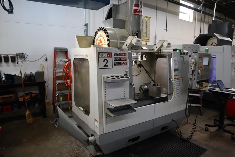 Haas VF-2SS CNC Vertical Machining Center, 12K Spindle, 4th Axis Brushless Drive with SHRT-160H Rotary Table, 24 Station SMTC, Probing, Chip Auger - Auction Item