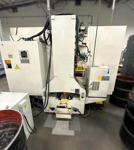 Bulova VMC-4220B Vertical Machining Center 2012 equipped with Fanuc OiMD Control, CT40 Spindle, 24 Station Automatic Tool Changer, Remote Jog Handle, Chip Conveyor, Chip Auger, Coolant Tank