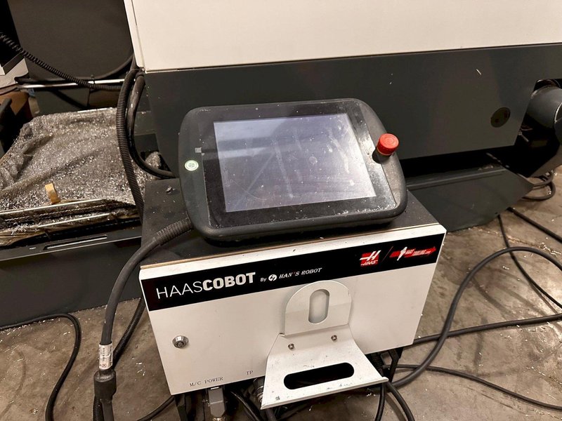 2024 HAAS VF-2SS with HC10 6-Axis Cobot with low hours. Vertical Machining Center