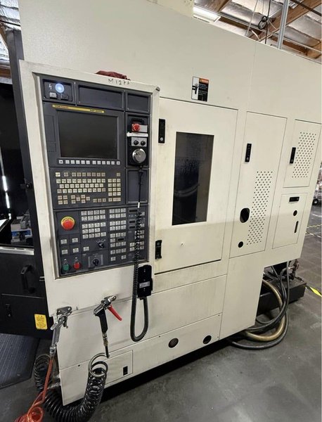 YCM NXV560A-APC VMC, 2015 – Chip Conveyor, Fanuc Control, 12K RPM