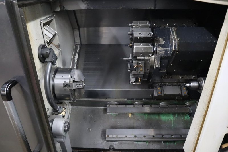 Doosan Lynx 300M CNC Turning Center with Live Milling, 12 Station Turret, 10&quot; 3-Jaw Chuck, Tailstock, Tool Presetter, Parts Catcher, Chip Conveyor- Auction Item