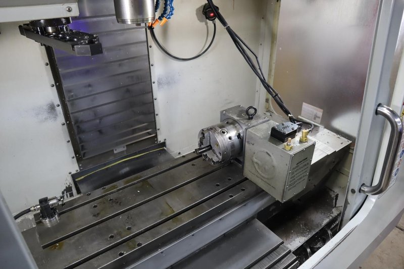 Haas VF-2SS CNC Vertical Machining Center, 12K Spindle, 4th Axis Brushless Drive with SHRT-160H Rotary Table, 24 Station SMTC, Probing, Chip Auger - Auction Item